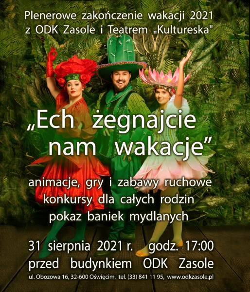 Zdjęcie przedstawiające dwie kobiety przebrane za czerwony  i różowy kwiat, po środku nich kucający, uśmiechnięty szeroko mężczyzna przebrany za kaktus. W tle zielone rośliny